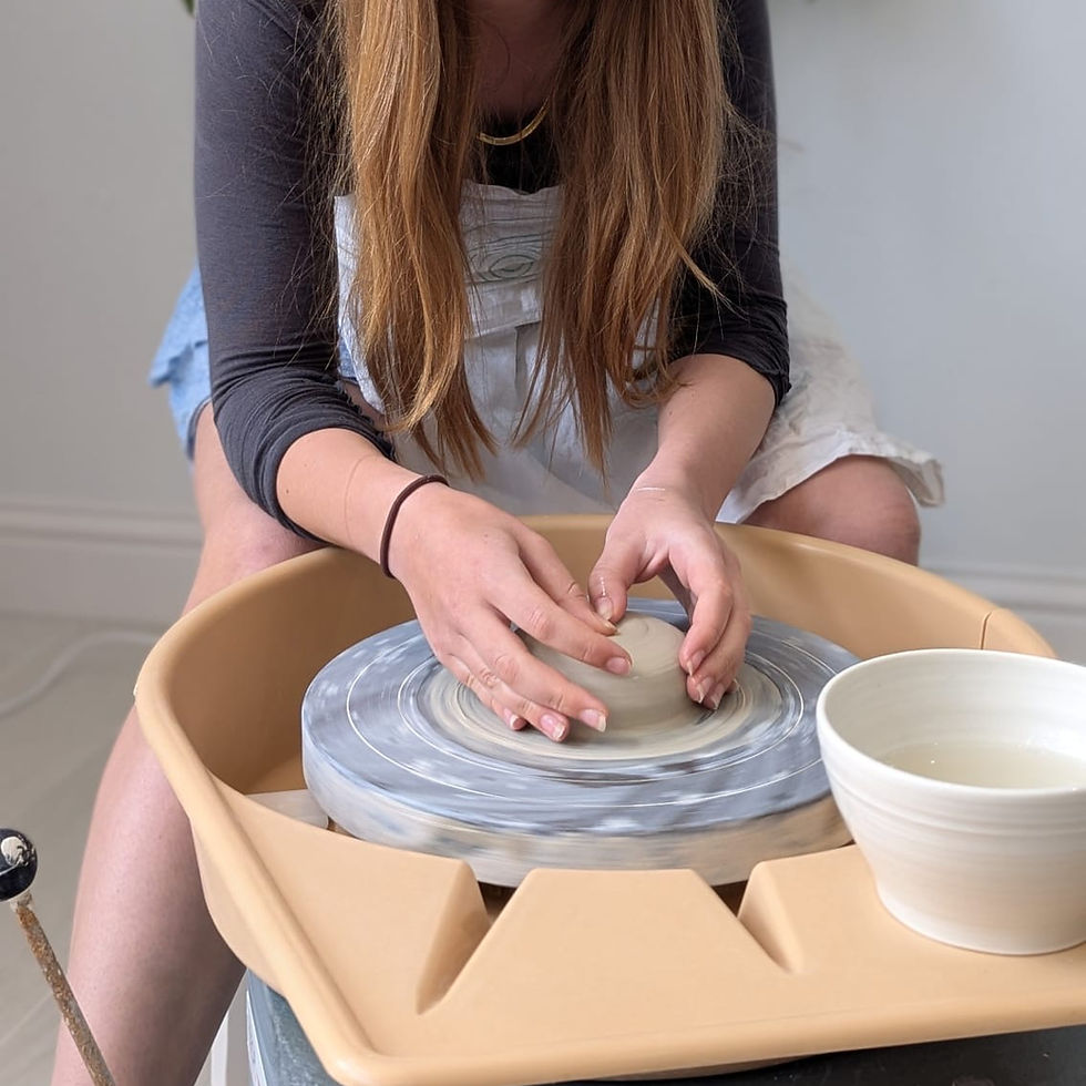 Thumbnail: Teen wheel throwing on the potters wheel in surrey pottery studio