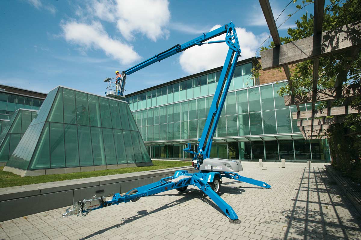 Genie TZ50, 50ft Electric Towable Knuckle Boom Lift — photo 1