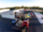 Tow trucks outside auto shop