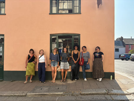 team standing outside the bulls inn in Totnes