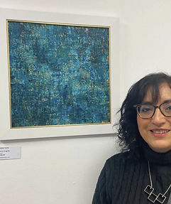Debbie Tearle with her work in an exhibition