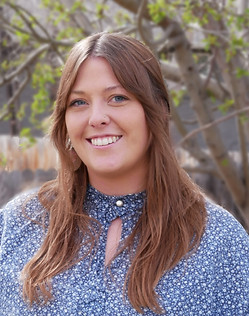 A headshot of Shannon Poulos, smiling.