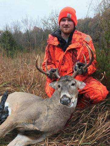 Hunter with antlers at Buck Haven Outfitters