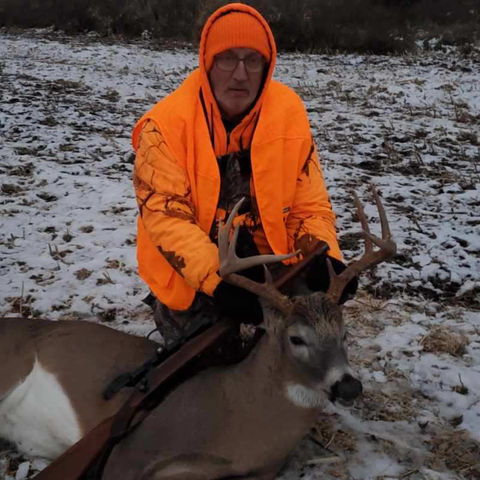 Hunter with Deer Buck Haven