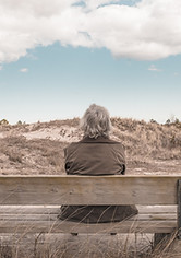 Man Sitting on a Bench