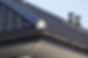 Close-up view of a corner of a grey roof.