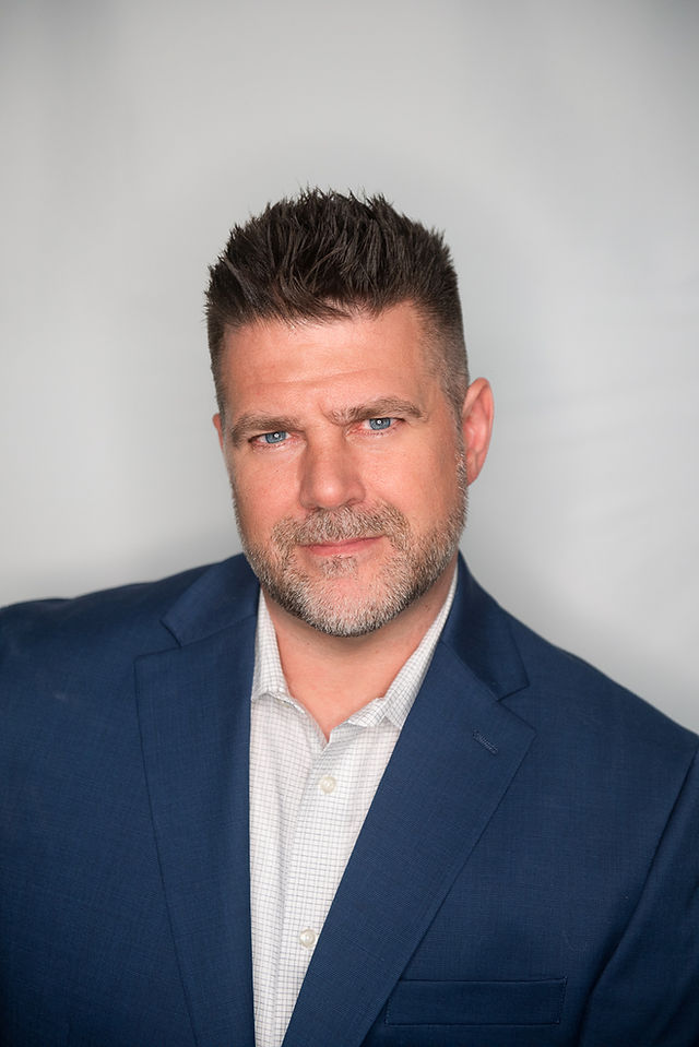 man in blue suit jacket