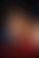 woman on bed with feathering top