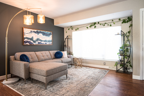 couch in living room of portrait studio