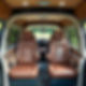 can you generate an image of a bespoke camper van conversion with custom leather seating a