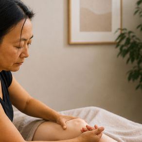 Rolfing often works beyond the site of pain — here, focused attention on the knee helps support the whole leg's alignment and movement.
