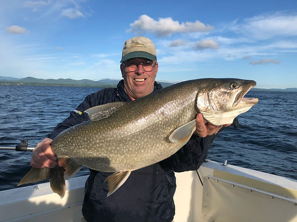Picture of man holding large lake trout