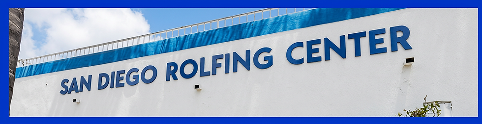 Architectural photography of large blue letters spelling "OLFING C" on a white building exterior. The clear sky indicates an outdoor setting.