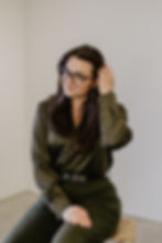 Headshot of women in green shirt and pants
