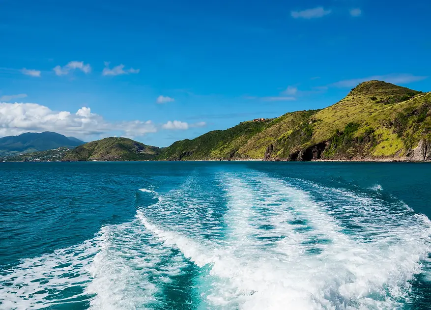 view-of-st-kitts-and-nevis-from-catamaran-in-ocean.webp