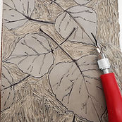 linocut tool overtop of artwork