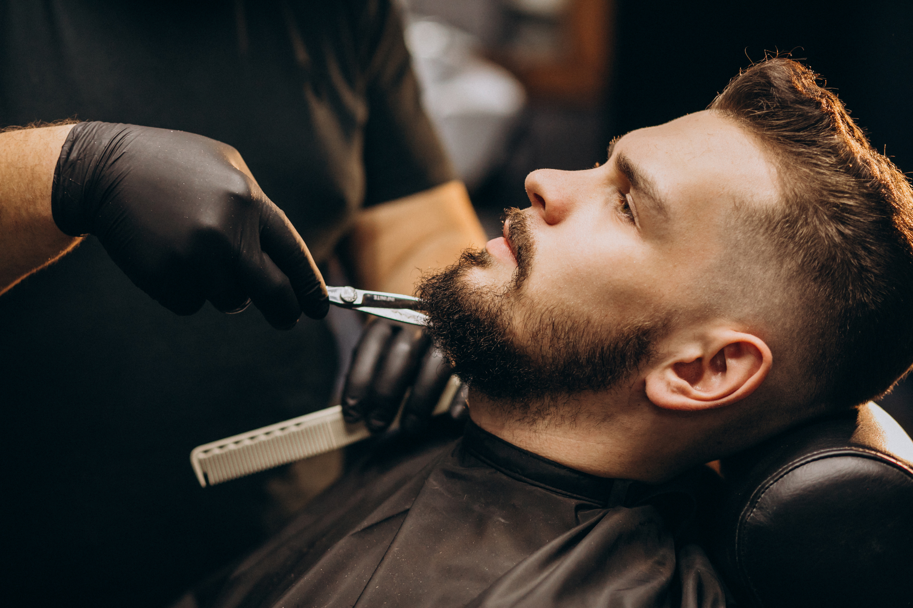 handsome-man-cutting-beard-barber-shop-salon.jpg