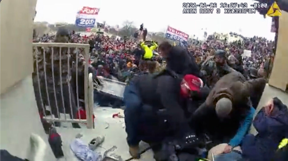 Protesters try to render medical assistance to Rosanne Boyland at the U.S. Capitol on Jan.