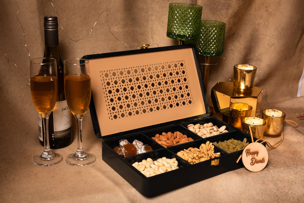 Diwali gift box with nuts, drinks, candles, 'Happy Diwali' tag