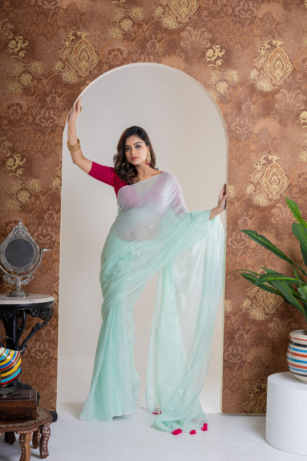Woman in saree wearing gold bangles