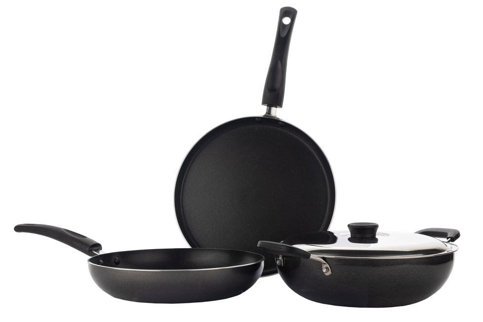 a set of black pans including a frying pan