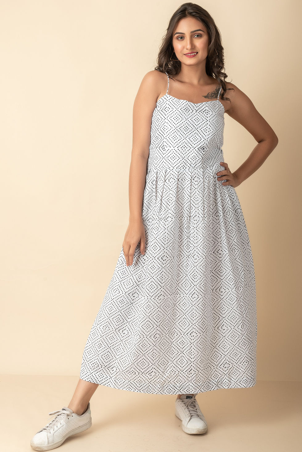 Woman in white maxi dress with pattern