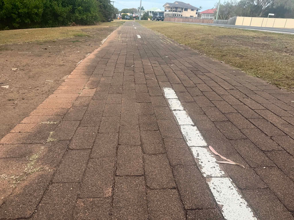 Uneven brick paver path on the Point Vernon Foreshore Reserve parkrun in Hervey Bay, Queensland.