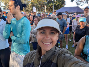 Chooky before Hervey Bay parkrun at Urangan, with volunteers in red vests behind her