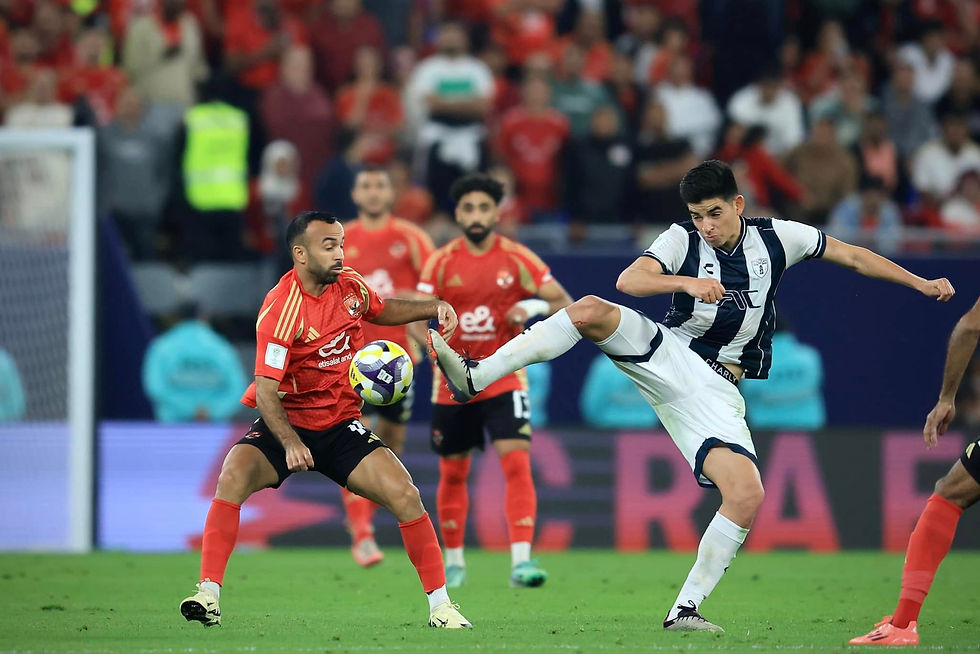 Mohamed Magdy "Afsha" challenges for the ball against Pachuca. Photo Credit: Al Ahly SC