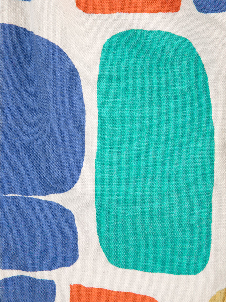 Close-up of the shorts showing abstract print and fabric texture.