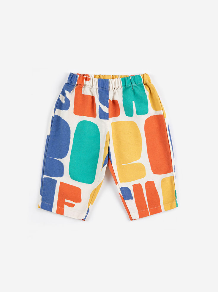 Children’s shorts with a colorful abstract block print and elastic waistband.