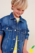 Child wearing Lemom & Pie Denim Jacket in medium blue wash, styled over a striped shirt.