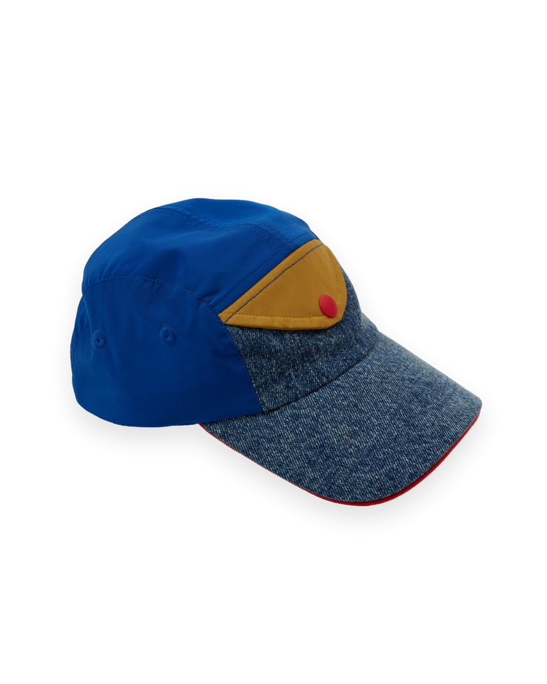 Children’s cap with blue crown, denim-textured brim, and yellow panel with red button detail.
