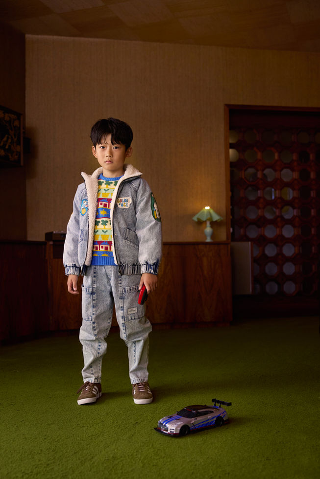 Child wearing Goldie & Ace Ari Denim Sherpa Jackets indoors