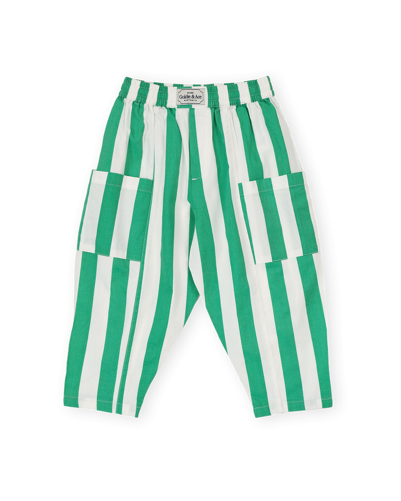 Green and white vertically striped children’s pants with an elastic waistband and large side pockets.