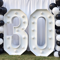 white marquee number 30 on ground with b
