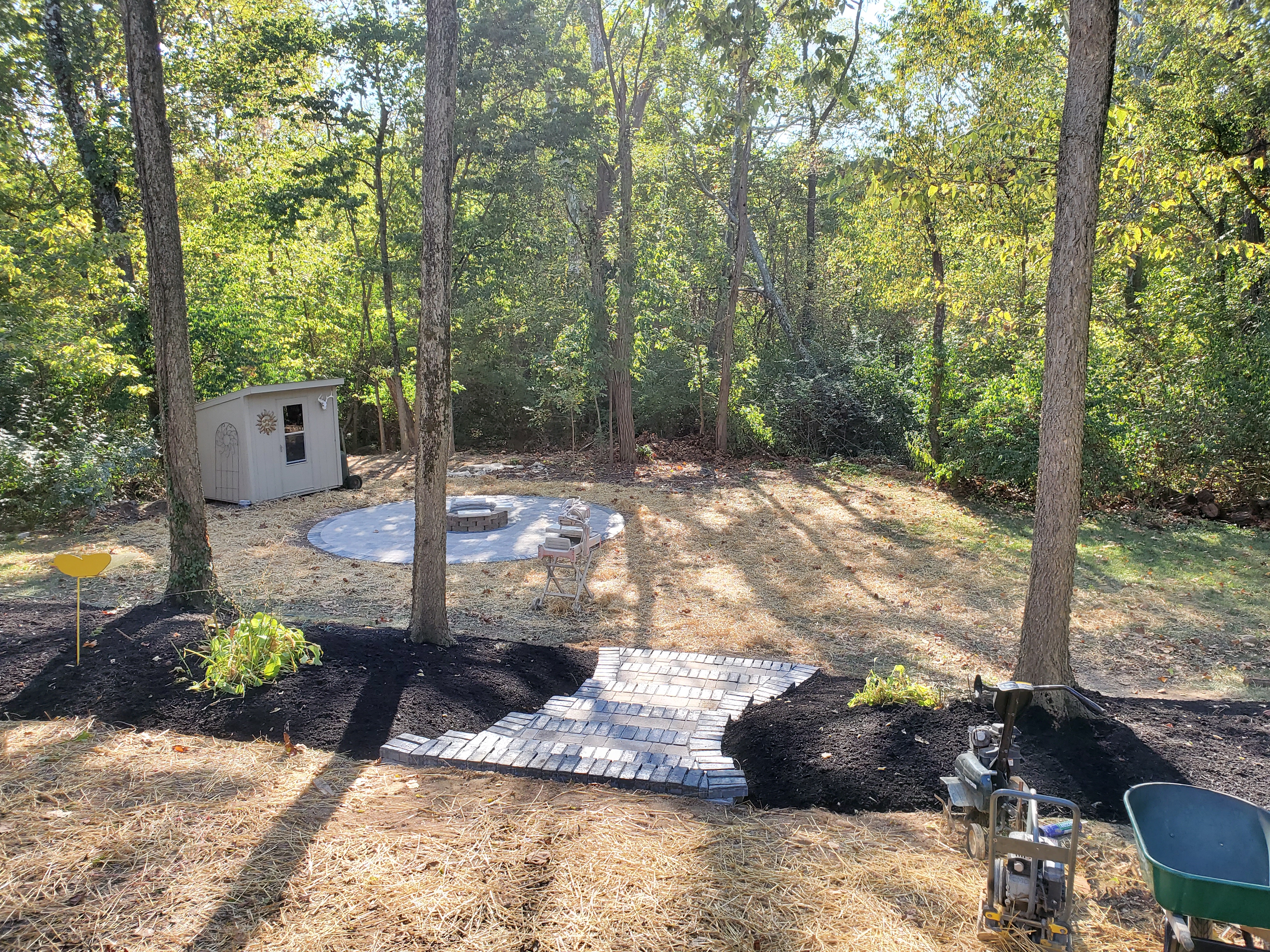Paver patio with fire pit and stairway i