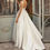 Thumbnail: Boho Chic Satin A-Line Wedding Dress with Pockets and Sweep Train
