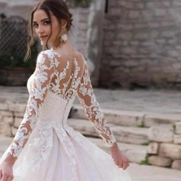 Thumbnail: Elegant Princess Wedding Gown with Long Sleeves and Embroidery | Classic Organza