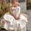 Thumbnail: Boho Chic Satin A-Line Wedding Dress with Pockets and Sweep Train