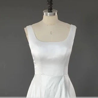 Thumbnail: Minimalistic Elegant Satin A-Line Wedding Gown with Spaghetti Straps and Sweep T