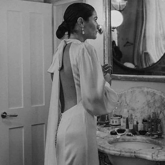 Thumbnail: Elegant Halter Neck A-Line Wedding Dress with Puff Sleeves and Backless Design