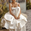 Thumbnail: Boho Chic Satin A-Line Wedding Dress with Pockets and Sweep Train