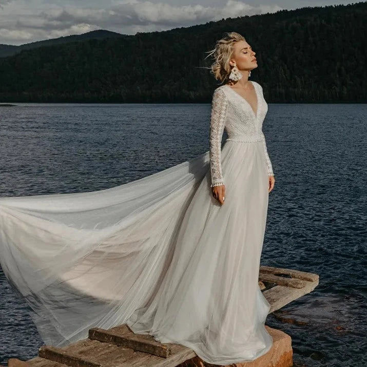Thumbnail: Boho Lace V-Neck Wedding Dress with Full Sleeves and Sweep Train - Elegant Backl