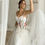 Thumbnail: Elegant White Tulle Prom Dress with Sweet Floral Details and Spaghetti Straps