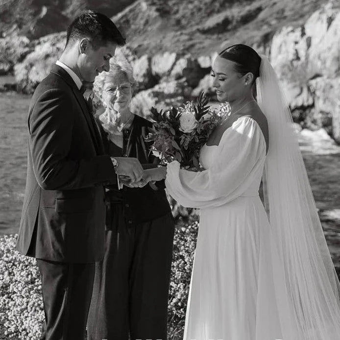 Thumbnail: Minimalist Wedding Dress with Square Neck and Puff Sleeves