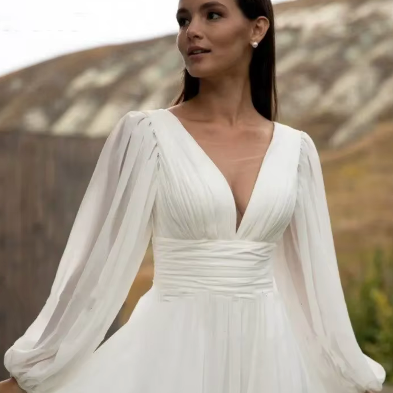 Elegant Flowy Bohemian Chiffon Wedding Dress with Puff Sleeves and V-Neck