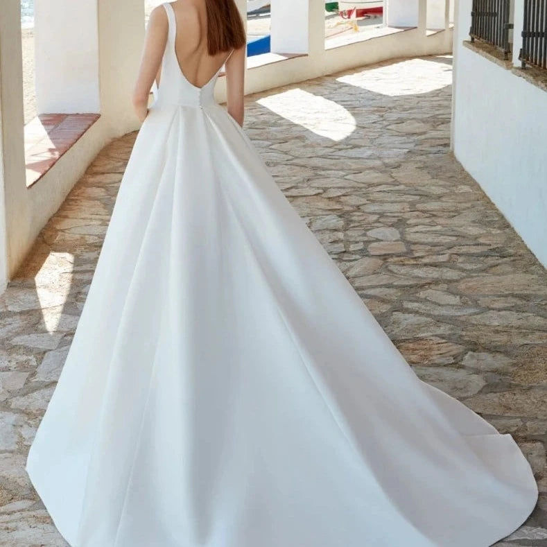 Thumbnail: Minimalistic Elegant Satin A-Line Wedding Gown with Spaghetti Straps and Sweep T