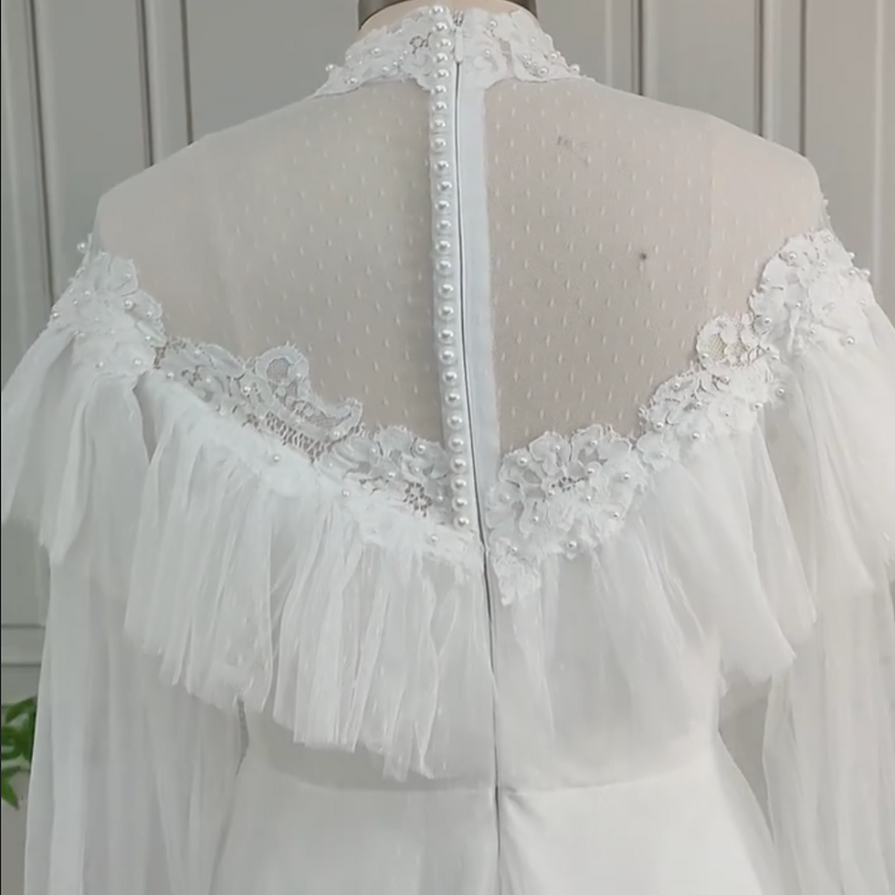Thumbnail: Vintage Victorian Wedding Dress with High Neck, A-Line Silhouette, and Pearl Emb