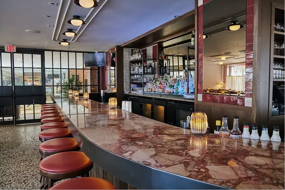 Raise a glass at Bar Enza’s chic and inviting bar